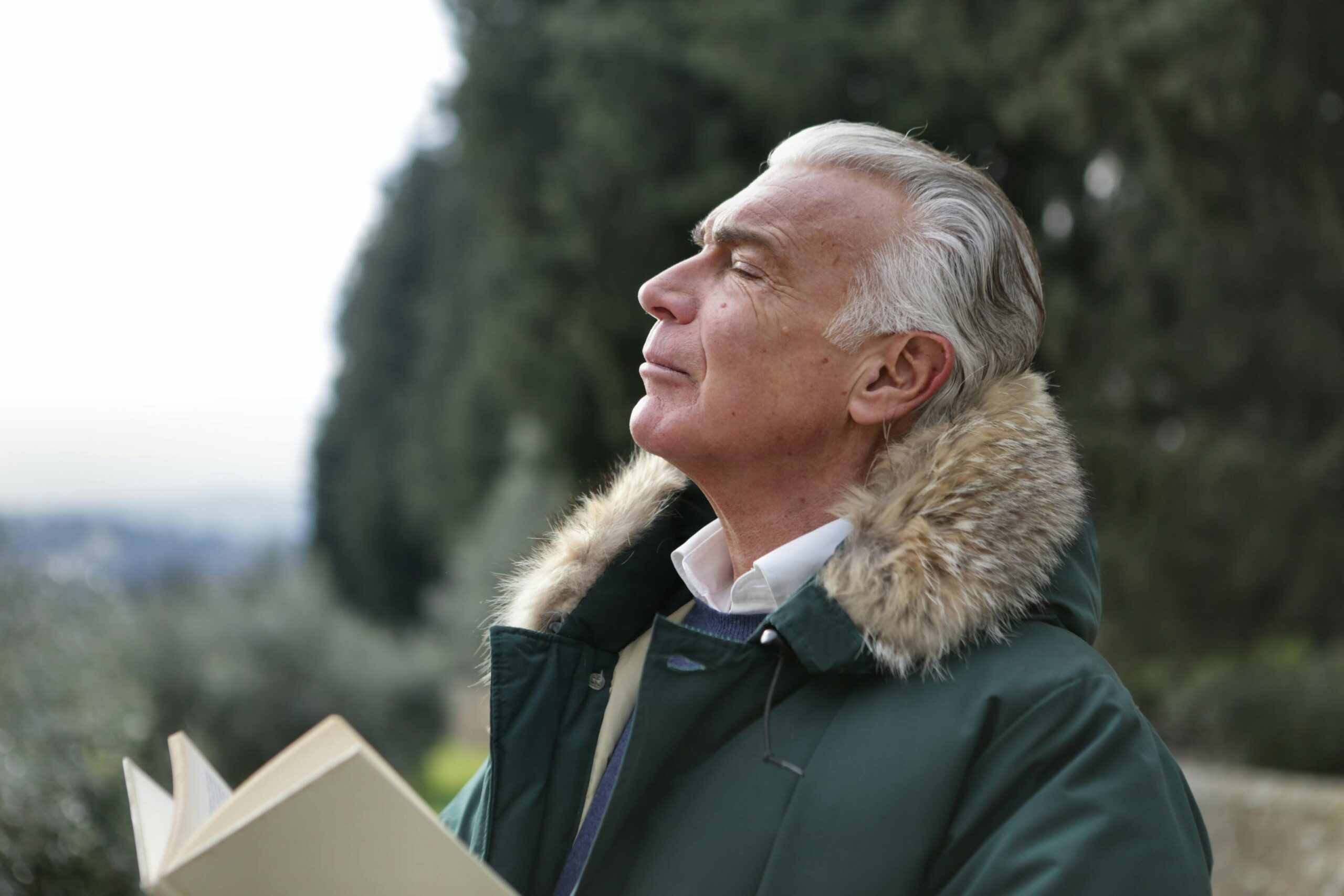 Patient outdoors with book